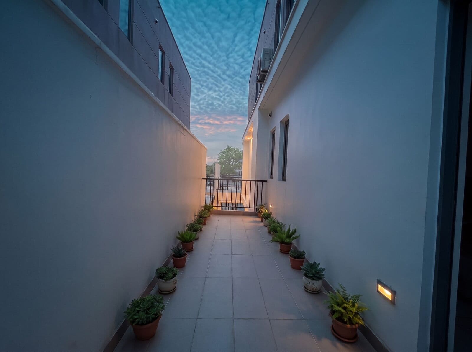 A room with a balcony at Kombat House at dawn