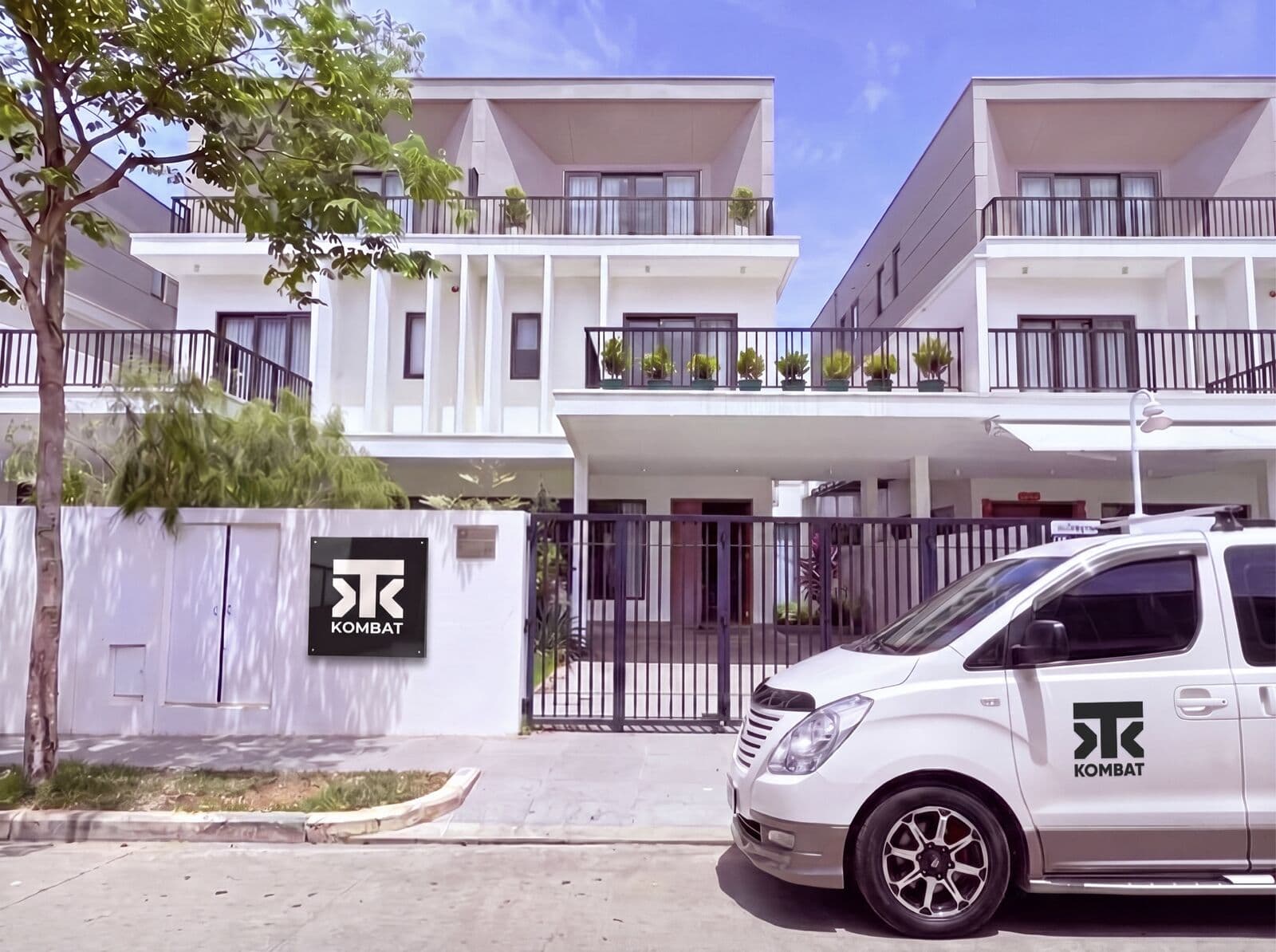 Kombat House from the street, with the Kombat van outside
